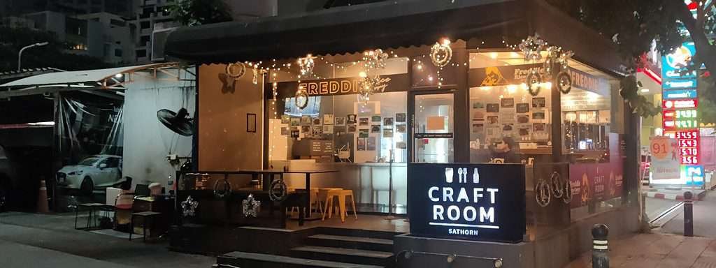 From outside Craft Room Sathorn at night.