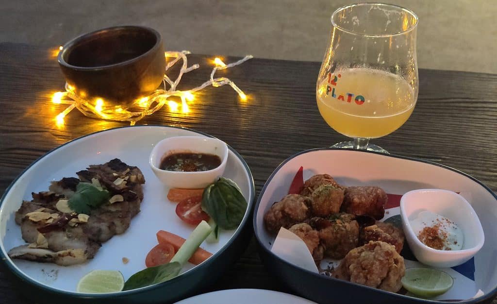 food on a wooden table at 12 Plato Brewing Bangkok Thailand