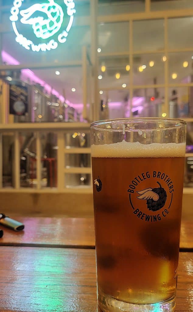 A pint of IPA craft beer in front of Bootleg Brother's brewing in Bangkok