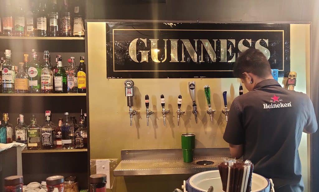 PJ O'Brien's Tap wall featuring Guinness poster.