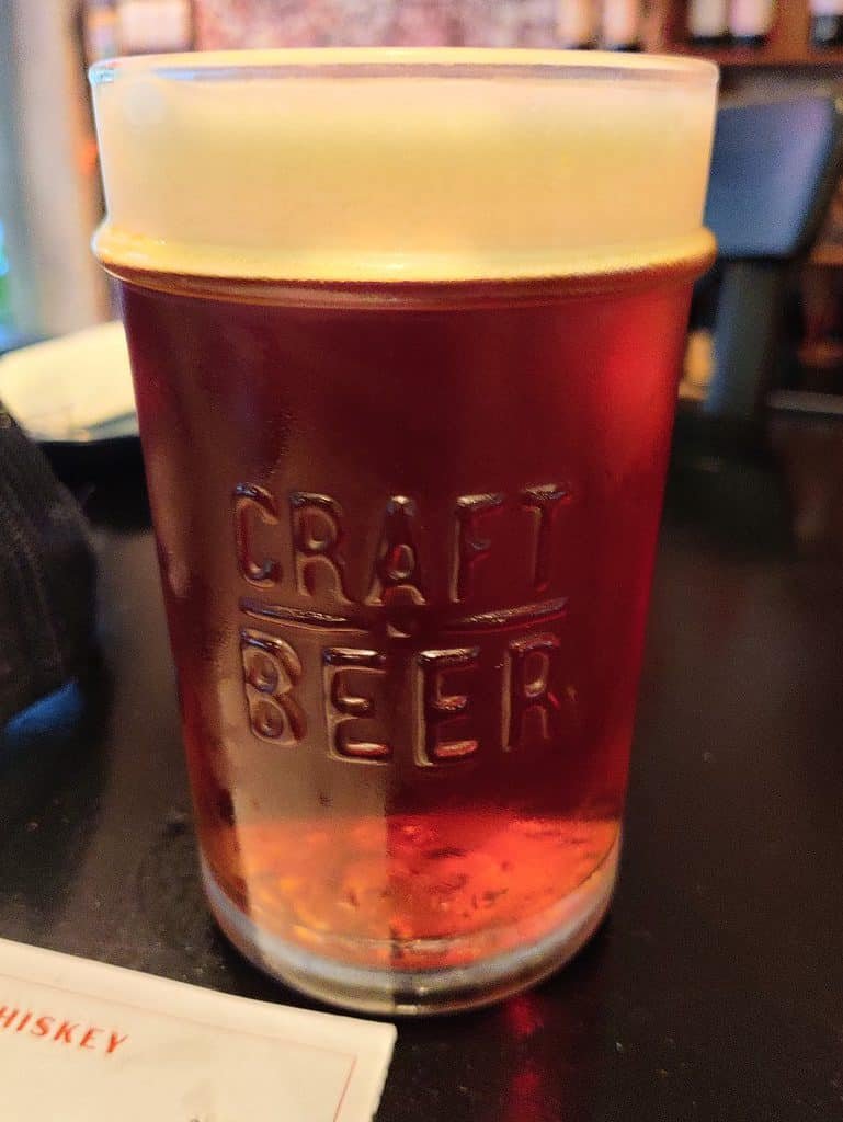 Pint of Rogue Dead Guy in a pint glass that says craft beer - at Billy's Smokehouse in Bangkok Thailand