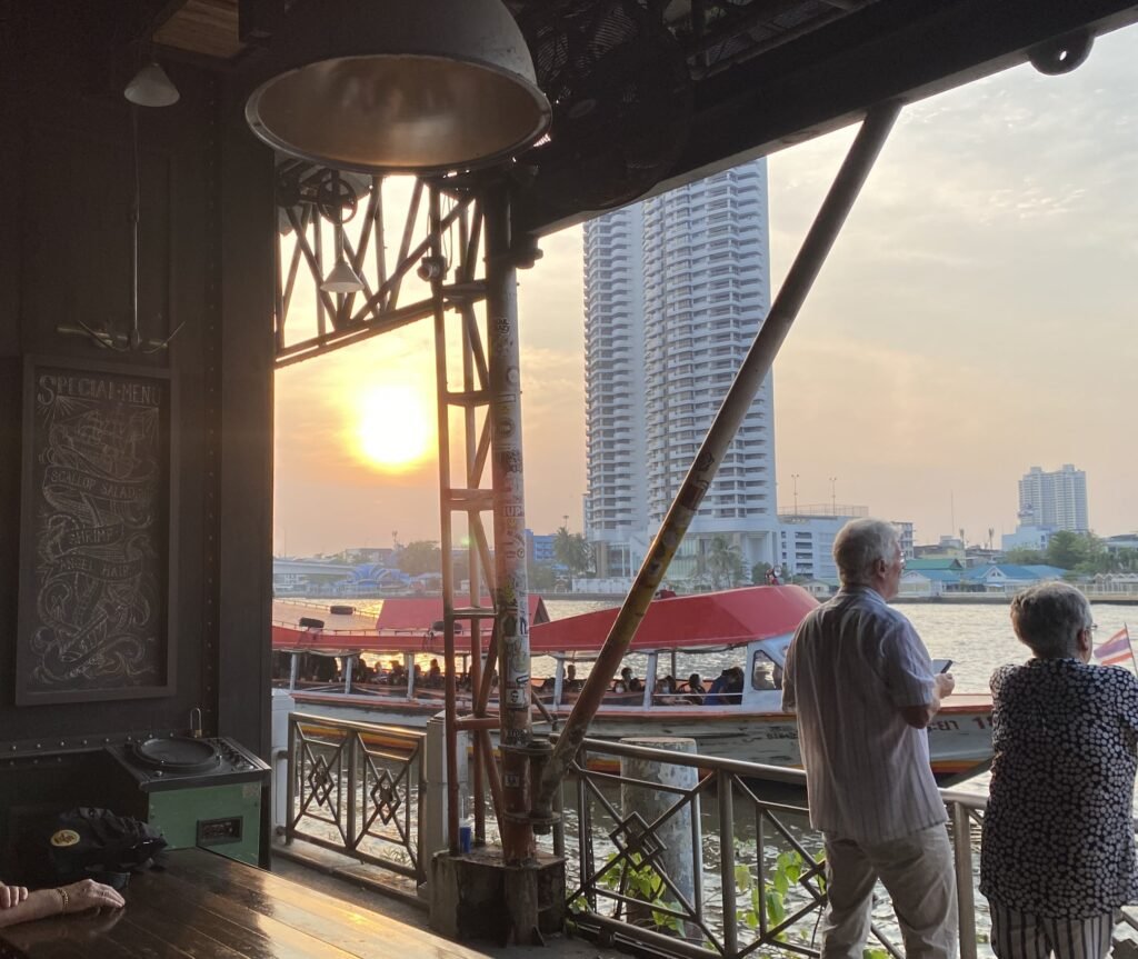 Sunset over the water at t Sheepshank Public house or Dock No. 13 in Bangkok Thailand.