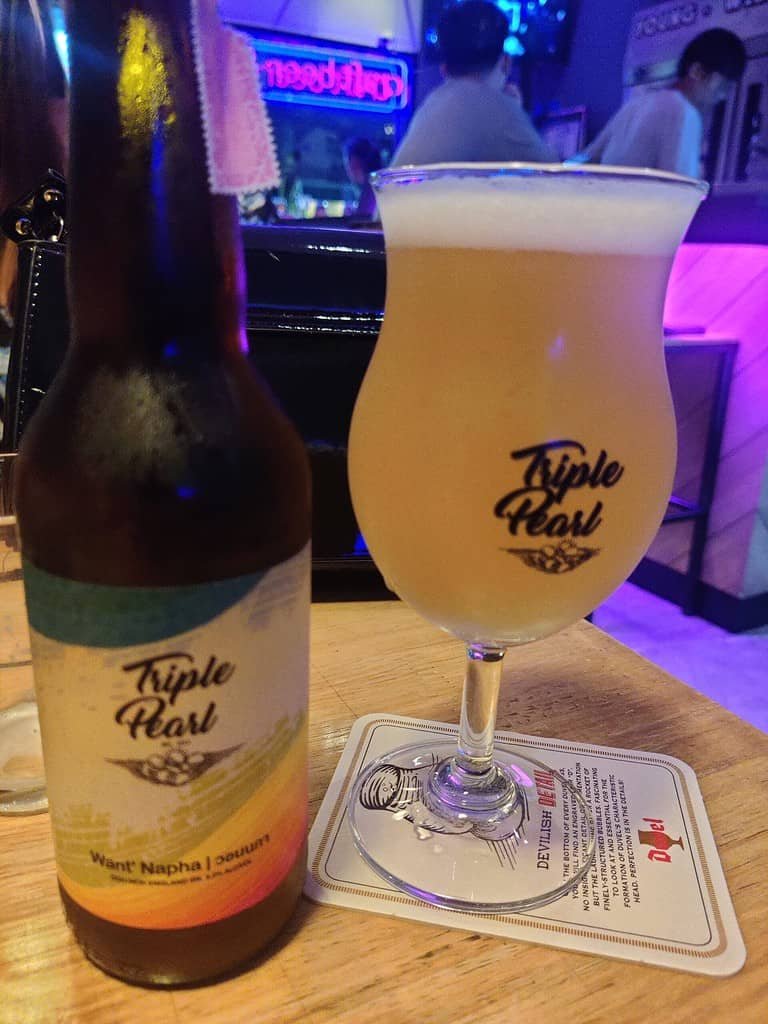 Triple Pearl Craft brewery from Thailand.  Bottle of Want' Napha served in a glass.