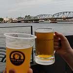 Chit craft beer branded beer mugs giving a cheers at Chit Hole, by Chit Brewery in Bangkok Thailand