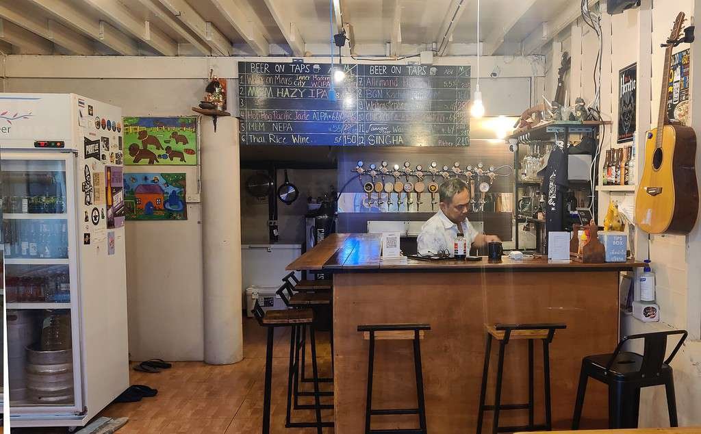 Warehouse Bar by Jaang craft beer in Bangkok Thailand. 
Picture of the bar including chalk board beer sign.  