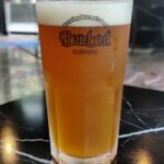 Glass of beer in a Burbrit branded glass in Bangkok Thailand