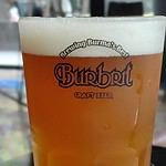 Glass of beer in a Burbrit branded glass in Bangkok Thailand