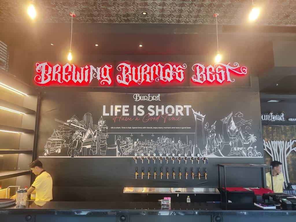 Wall behind the bar at Burbrit Craft Beer bar in Bangkok Thailand. Beer from Burma, served in the Thai Capital. 