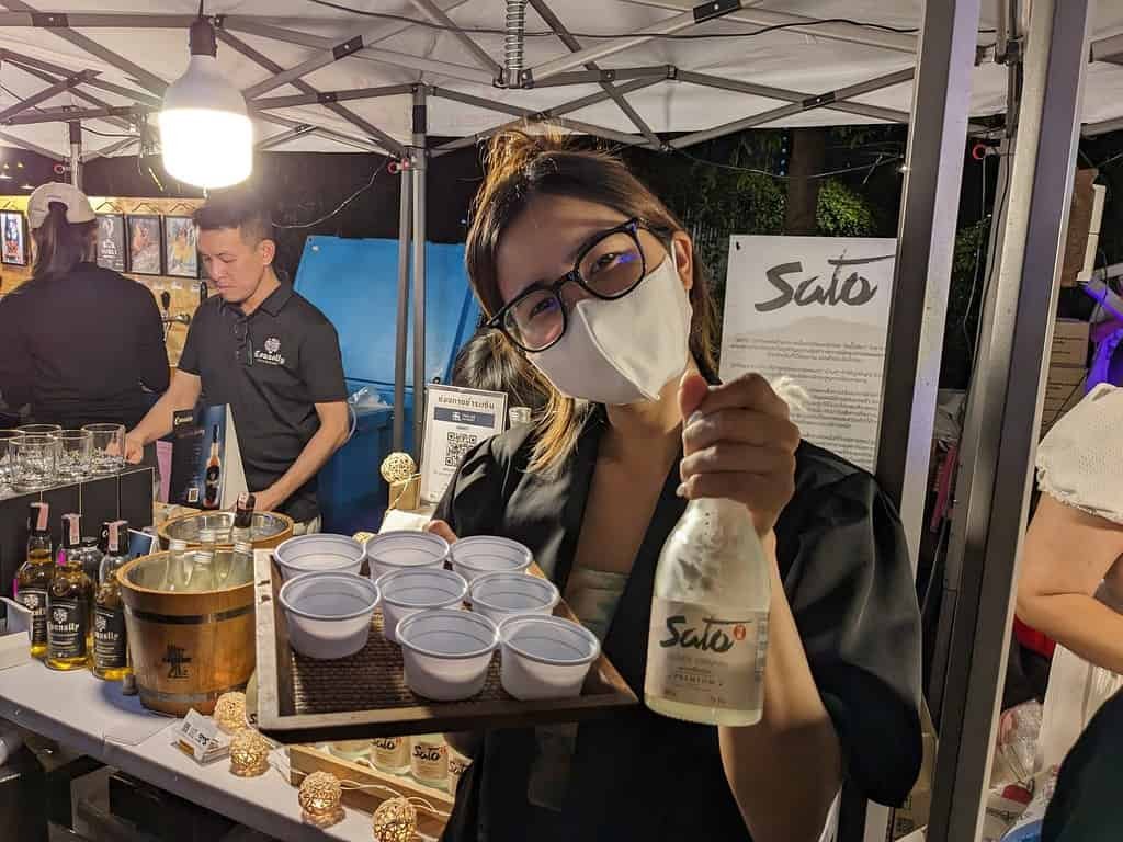 Sato, Thai alcohol, samples and for sale at Beer Market 2 at Chang Chui Creative Park in Bangkok, Thailand. 
Organized by ประชาชนเบียร์ (Beer People).