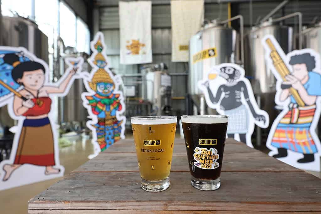 2 beers, dark and gold, at Thai Craft Beer Week media event at United People's Brewery in Bangkok Thailand.
