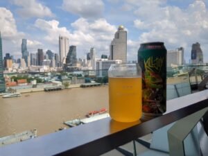 Drinking craft beer overlooking the Chao Phraya river in Bangkok,  Thailand