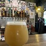 Glass of hazy craft beer at Dok Kaew House bar in Bangkok Thailand