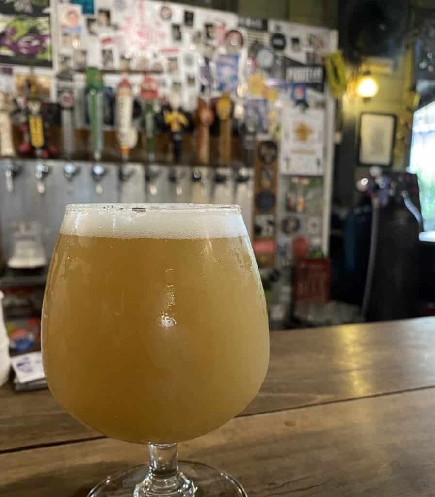 Glass of hazy craft beer at Dok Kaew House bar in Bangkok Thailand