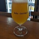 Duke of Beerington branded glass holding craft beer in Bangkok Thailand