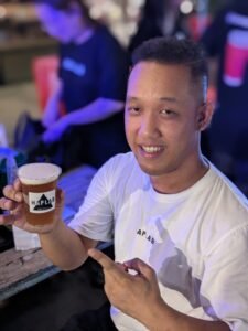 Picture of Haplab and the brewer Pitch. Showing off his spicy craft beer made with watermelon and carolina reaper chilis. IN Bangkok Thailand.