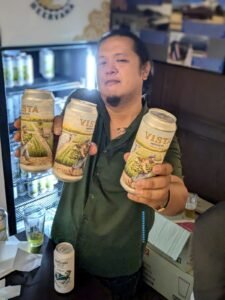 Cans of Vista IPA by the Brewing Project being held and served at the launch party held at JUSMAGTHAI. For the Bangkok Beer Guide