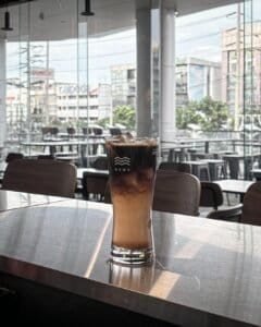 Brewave Ratchada branded glass on clean counter, Bangkok