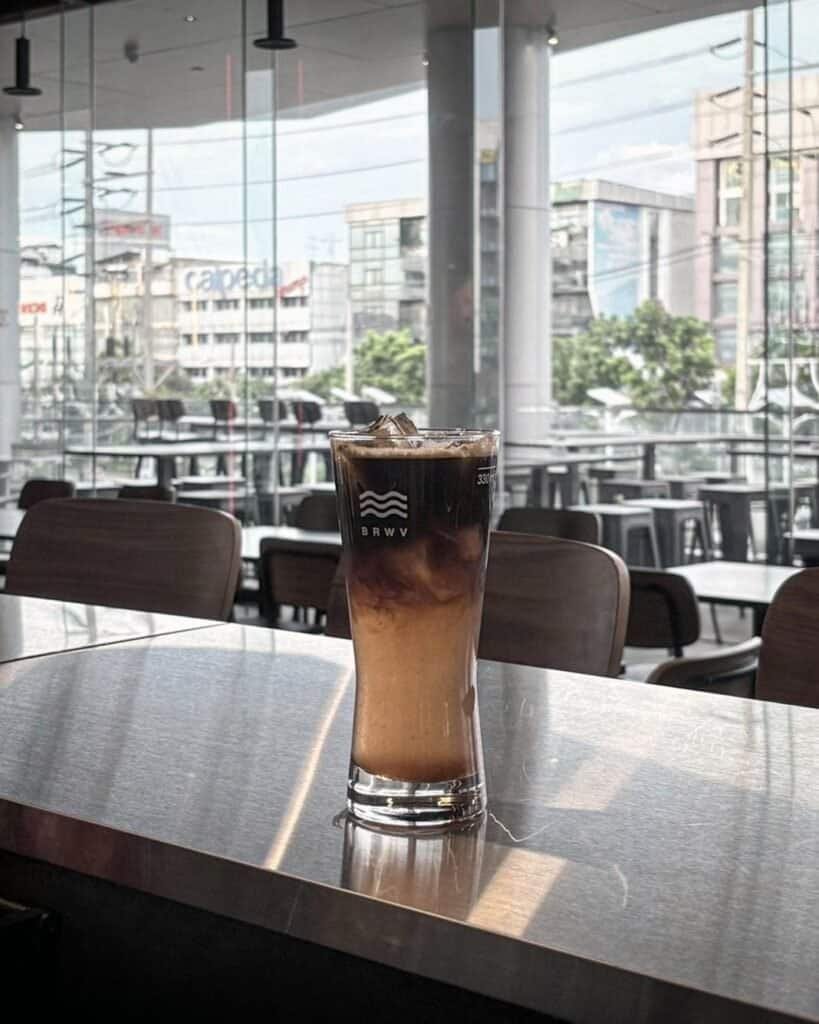 Brewave Ratchada branded glass on clean counter, Bangkok