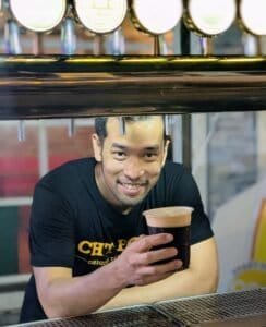 Serving smiles and stout at Chit Hole Terminal Bangkok Thailand